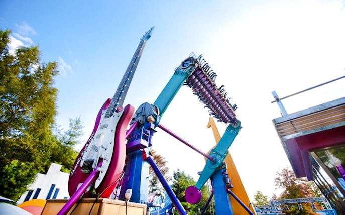Everland Theme Park ride with giant guitar and rotating seats.