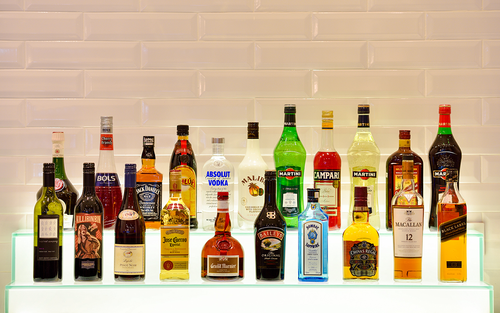 Beverage bottles displayed at Plaza Premium Lounge, Singapore airport.