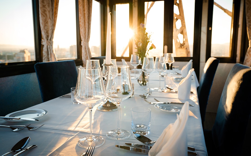 Dinner table set at sunset inside cabin on Vienna Giant Ferris Wheel.