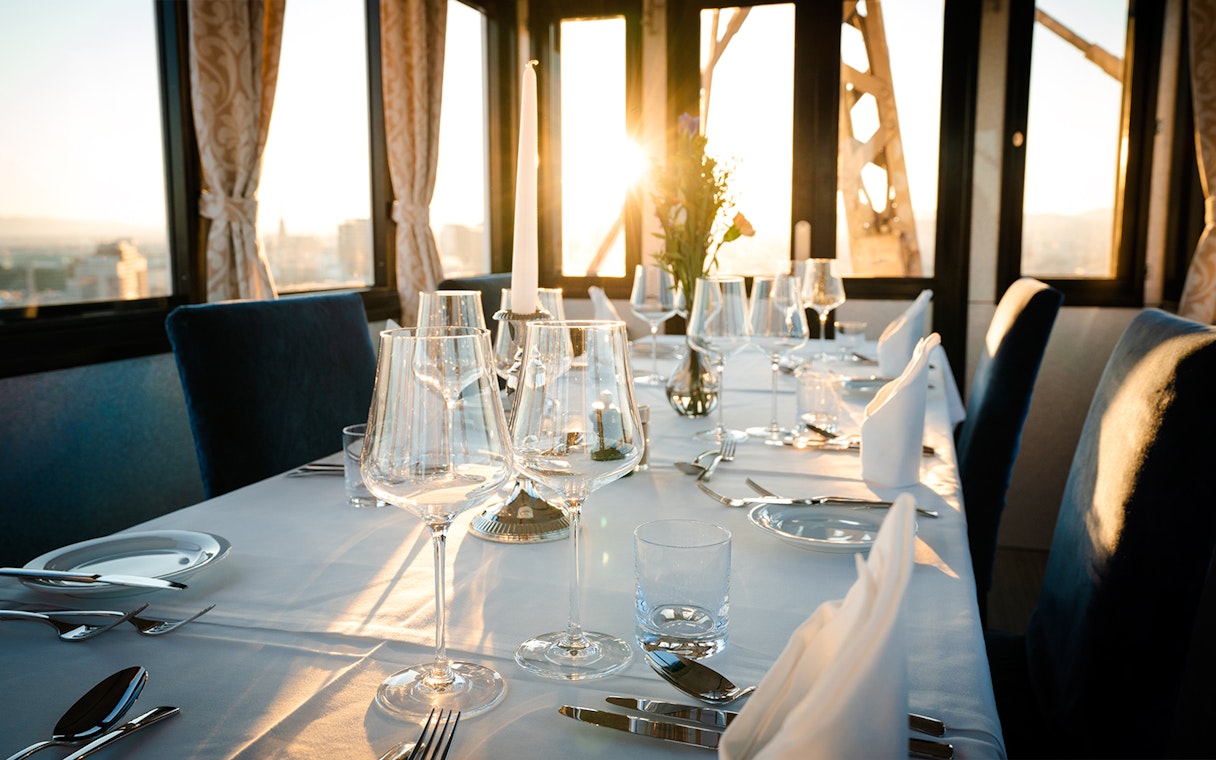 Dinner table set at sunset inside cabin on Vienna Giant Ferris Wheel.