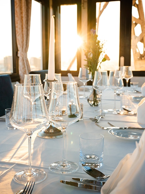 Dinner table set at sunset inside cabin on Vienna Giant Ferris Wheel.