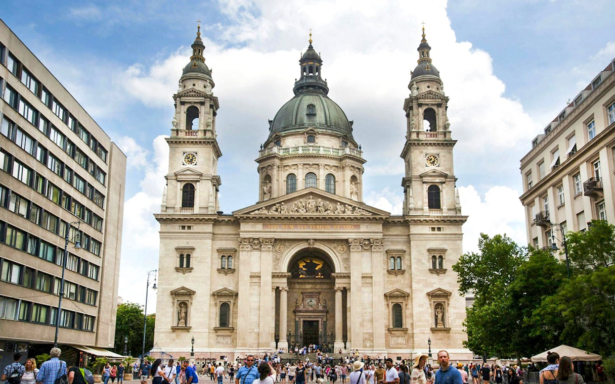 St. Stephen's Basilica exterior with a crowded entrance in Budapest.