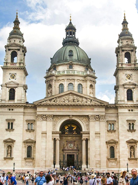 St. Stephen's Basilica exterior with a crowded entrance in Budapest.