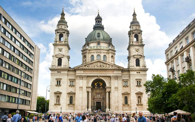 St. Stephen's Basilica exterior with a crowded entrance in Budapest.