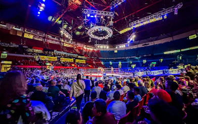 Crowd watching a Lucha Libre wrestling match at Arena Mexico.