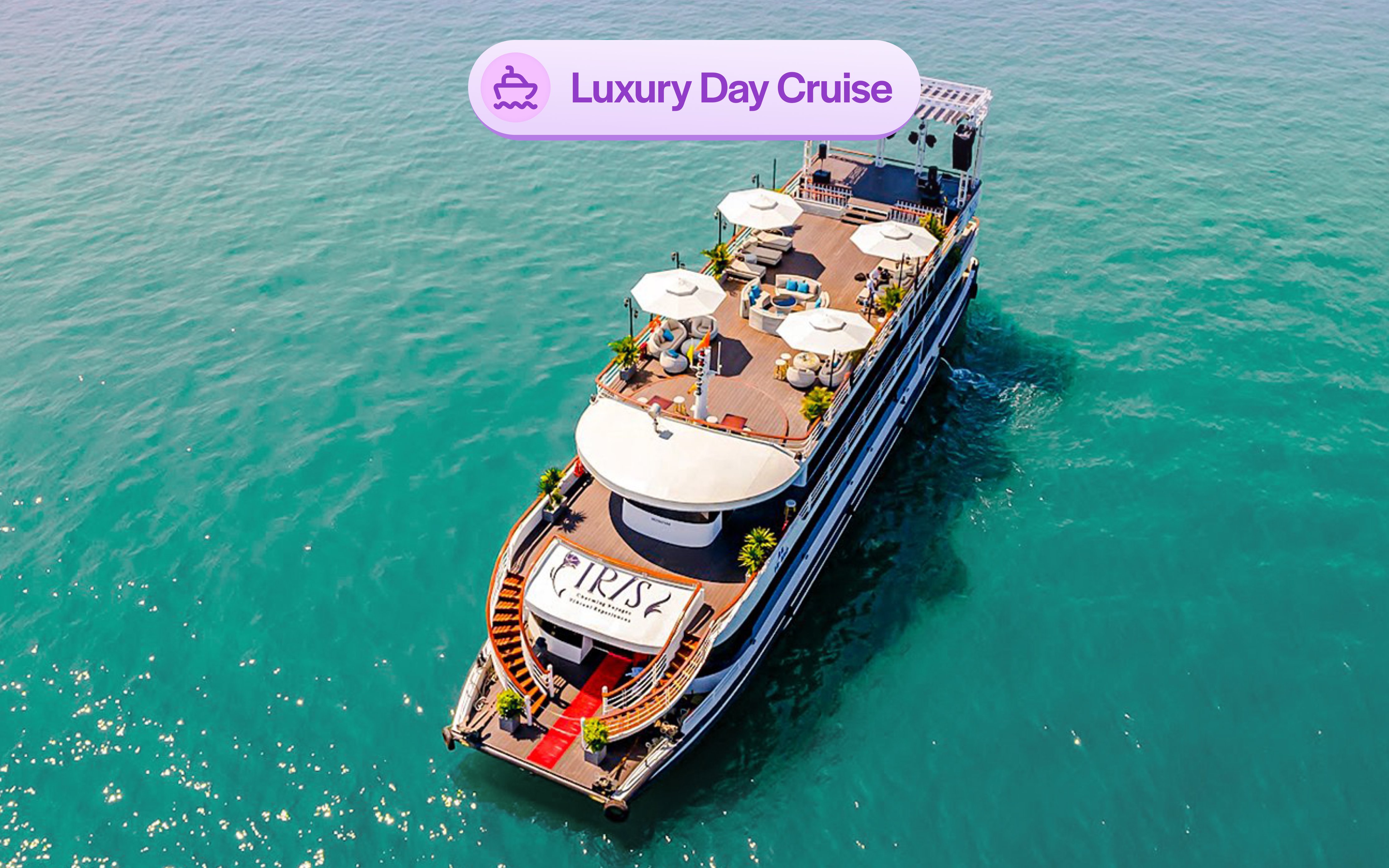 Luxury cruise ship Iris on Ha Long Bay with sun decks and seating areas.