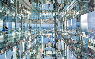 Visitors exploring mirrored observation deck at SUMMIT One Vanderbilt, New York City.