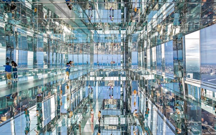 Visitors exploring mirrored observation deck at SUMMIT One Vanderbilt, New York City.