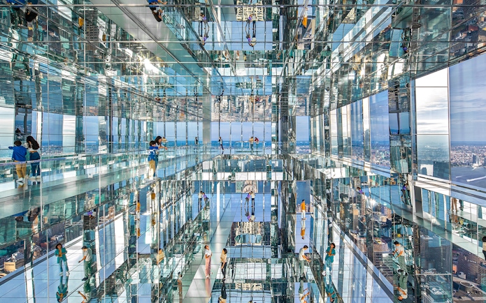 Visitors exploring mirrored observation deck at SUMMIT One Vanderbilt, New York City.