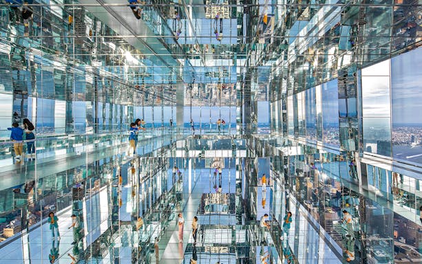 Visitors exploring mirrored observation deck at SUMMIT One Vanderbilt, New York City.