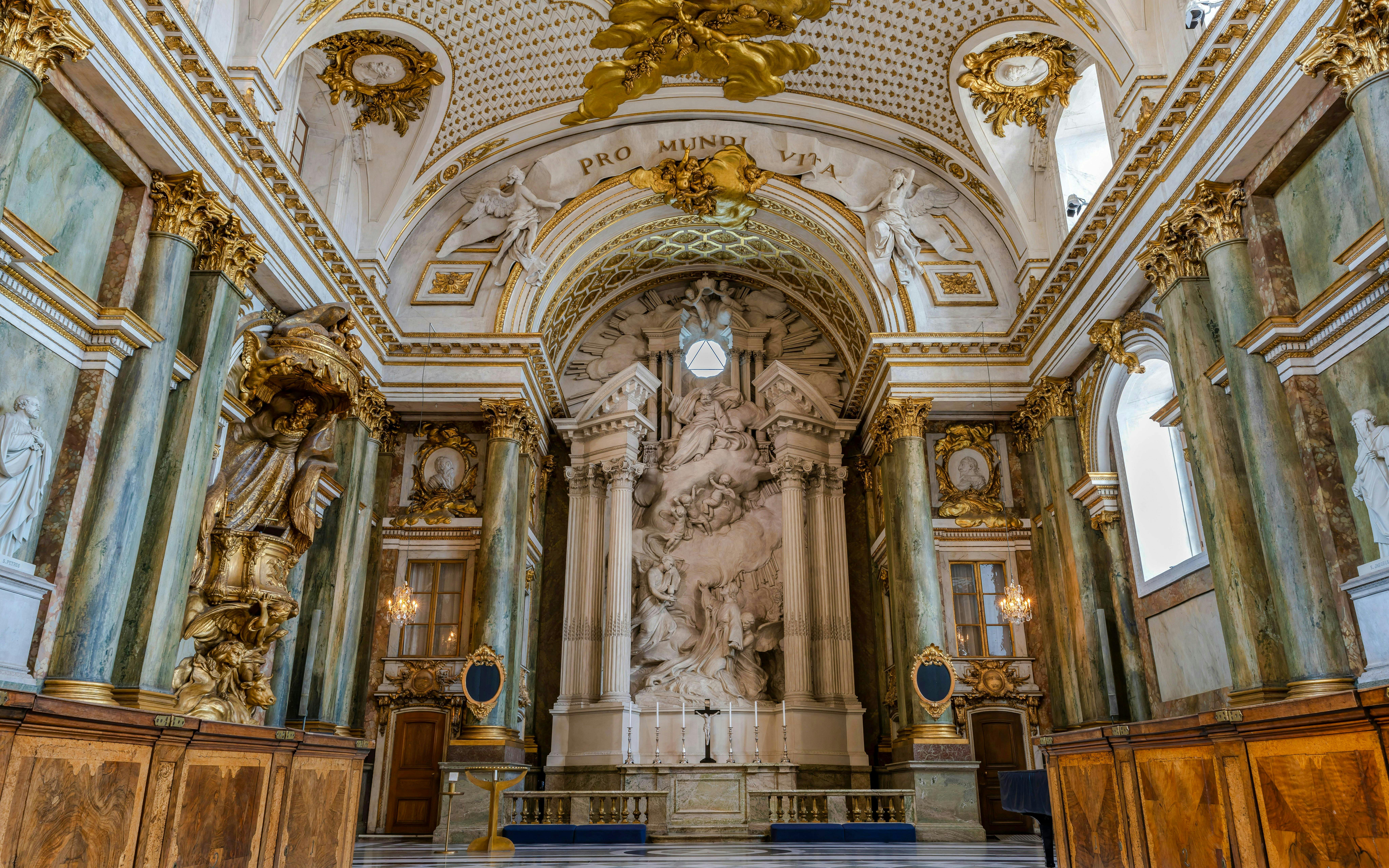 Interior view of the Royal Chapel at the Sweden Royal Palace, featuring ornate columns and sculptures.