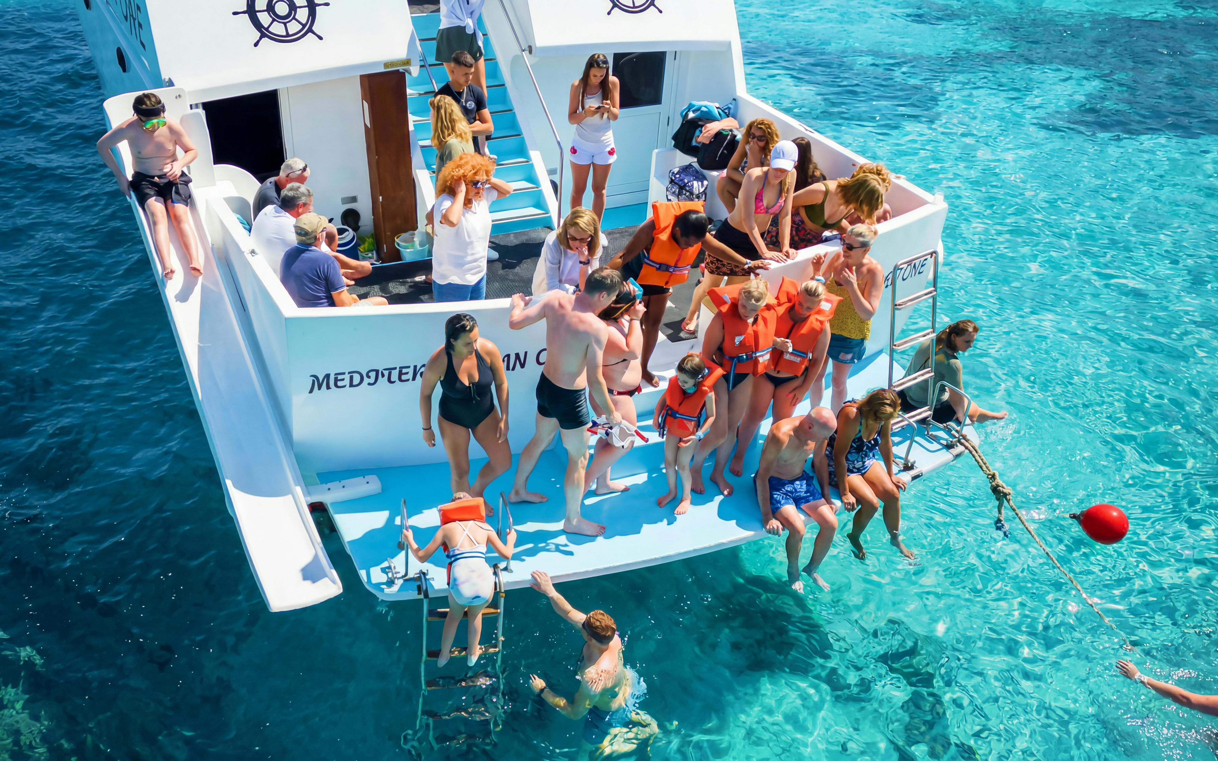 Tourists on a boat enjoying the Blue Lagoon cruise from Latchi, Cyprus.