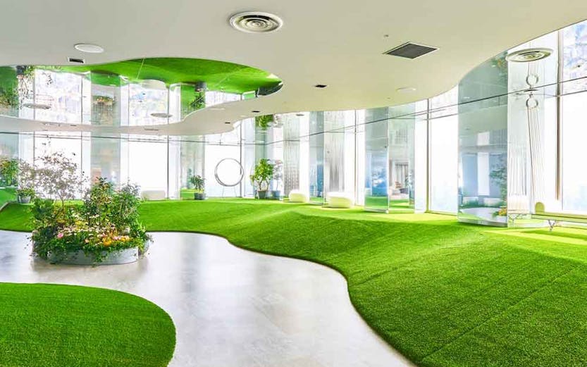 Sunshine 60 Observatory Tenbou Park interior with green turf and plants.