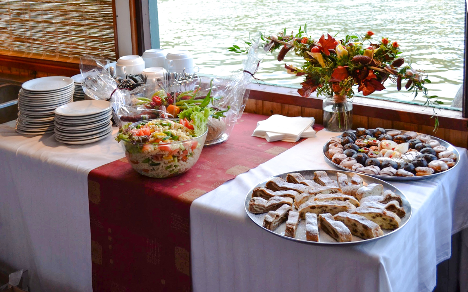 Snacks on a table aboard the historic ship Maria Croon on the Vltava River, Prague.