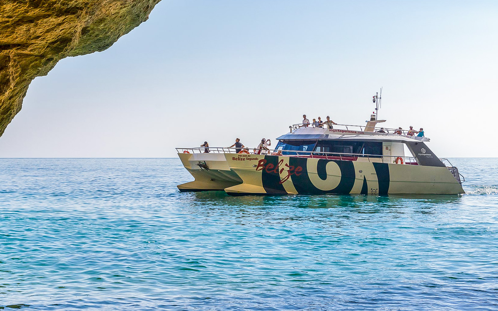 Catamaran near Benagil Caves on Algarve sightseeing cruise from Albufeira.