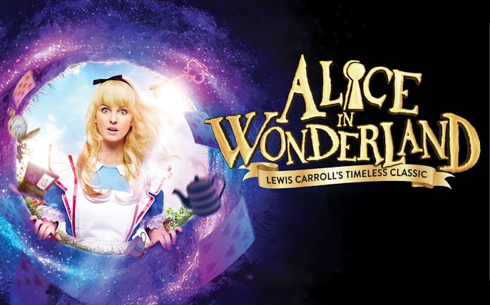 Alice in Wonderland stage show with vibrant costumes and whimsical set design.