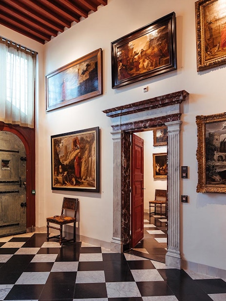 Paintings displayed in a room at the Rembrandt House Museum, Amsterdam.