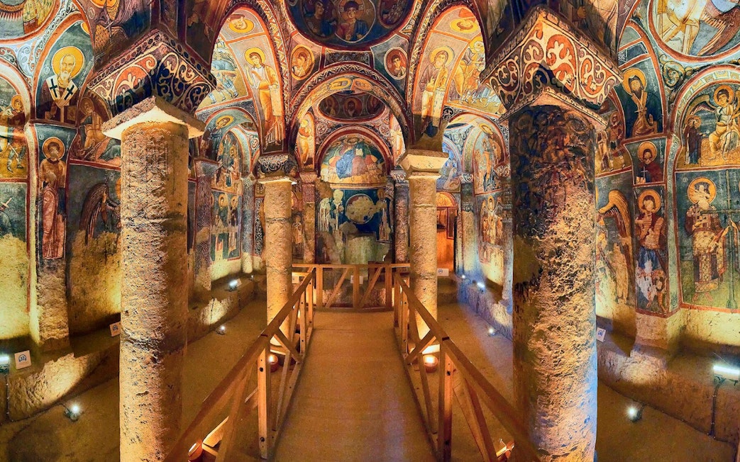 Interior of a rock-cut church with frescoes in Göreme Open Air Museum, Cappadocia, Turkey.