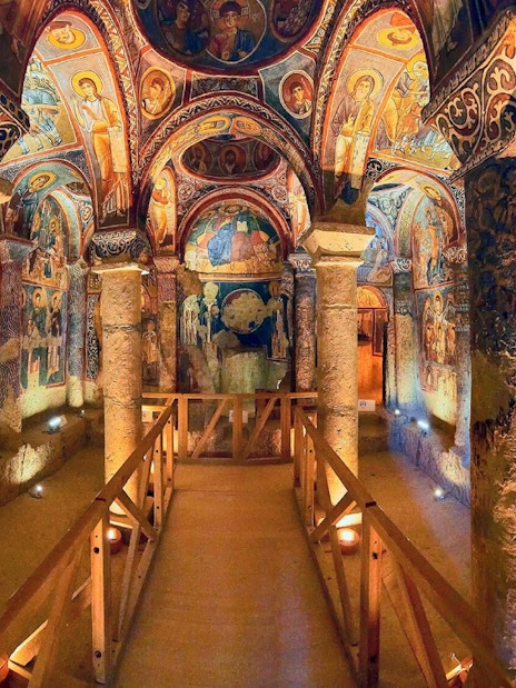 Interior of a rock-cut church with frescoes in Göreme Open Air Museum, Cappadocia, Turkey.