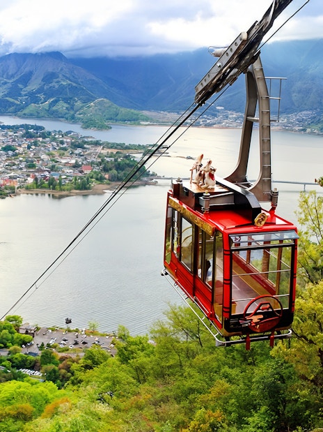 Mt Kachi Ropeway cable car overlooking Lake Kawaguchi and surrounding mountains in Japan.