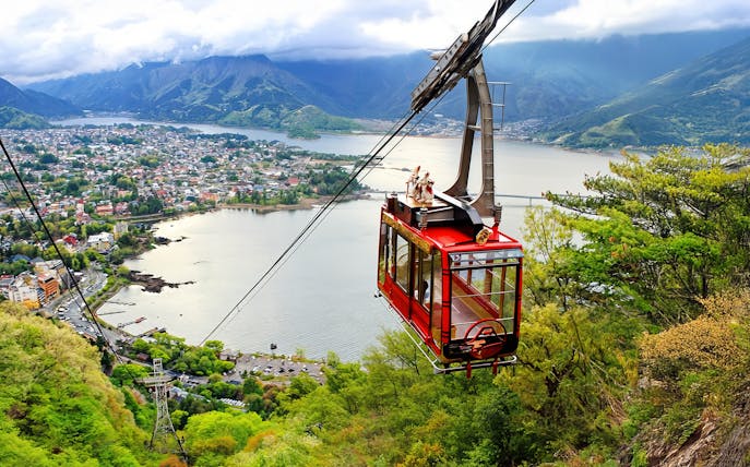 Mt Kachi Ropeway cable car overlooking Lake Kawaguchi and surrounding mountains in Japan.