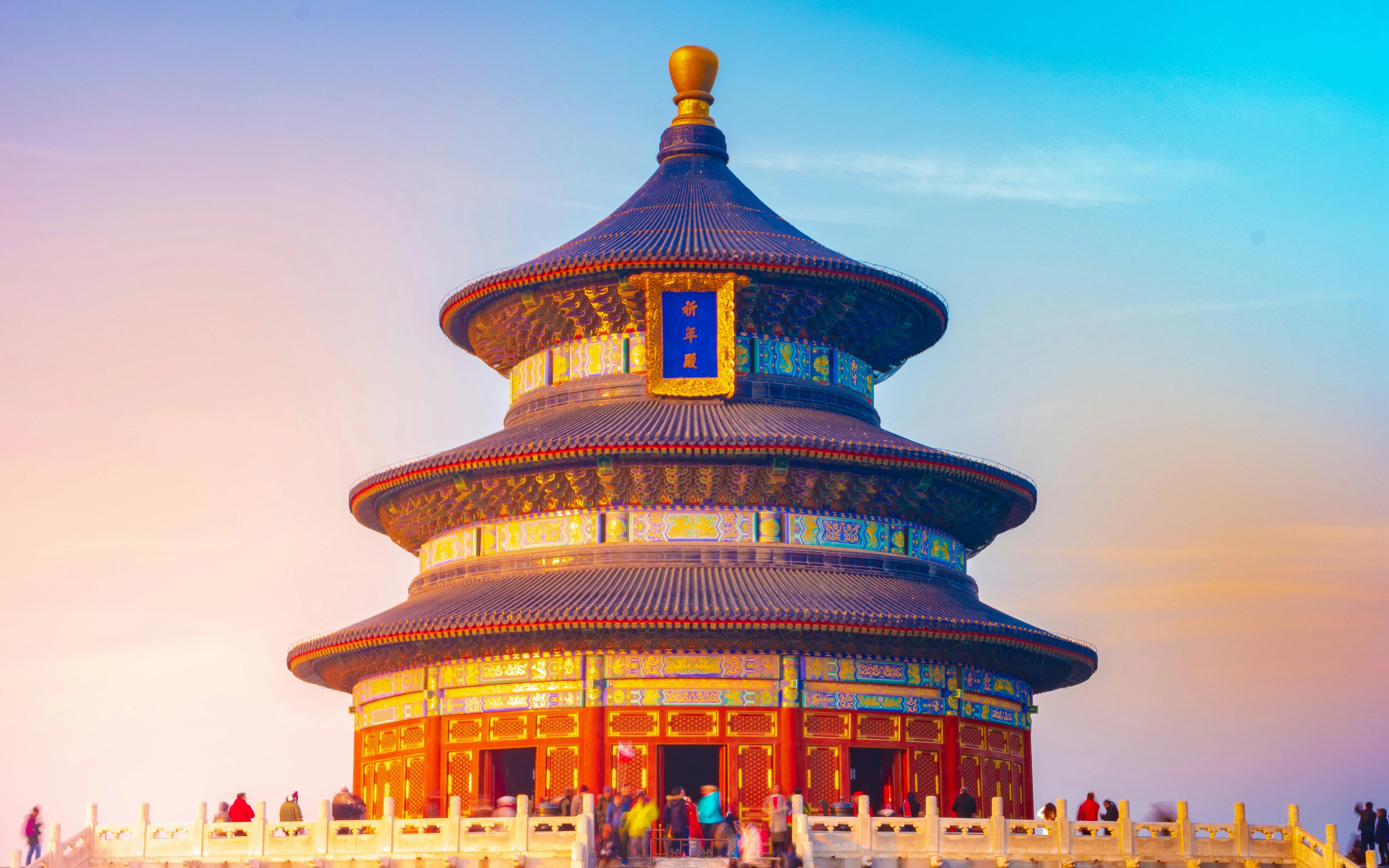 Temple of Heaven's Prayer Hall in Beijing, China, under a colorful sky.