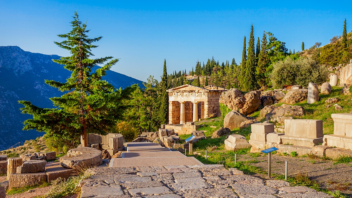 Ancient ruins and temple at Delphi archaeological site, Greece.