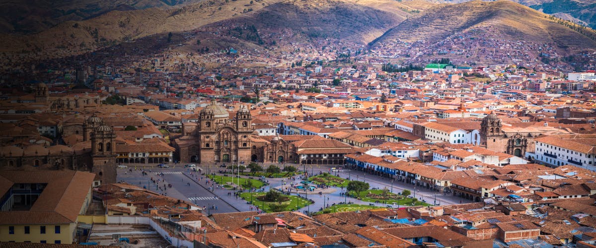 Cusco cityscape with Plaza de Armas and surrounding mountains, Peru.