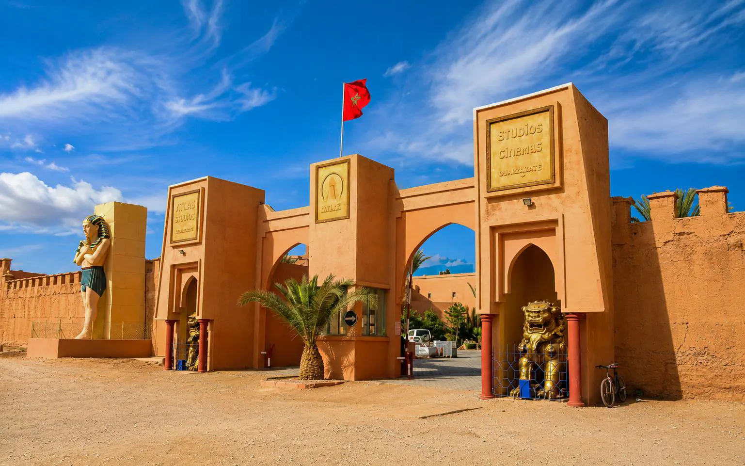 Entrance to Atlas Corporation Studios with statues, Ouarzazate, Morocco.