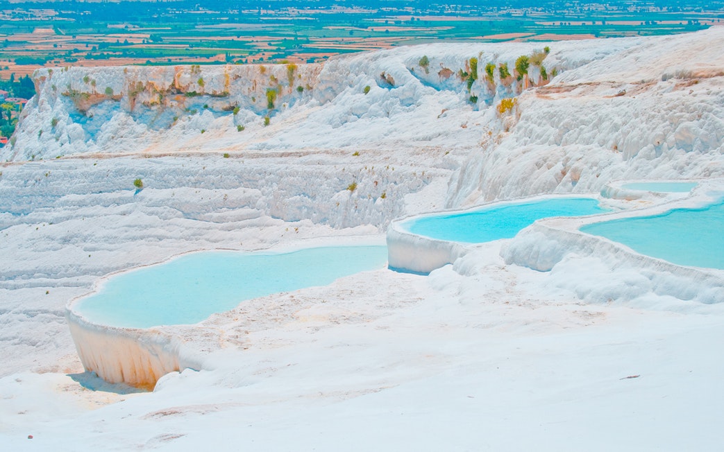 Pamukkale thermal terraces with turquoise pools in Turkey.