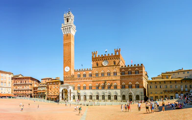 Piazza del Campo in Siena with Torre del Mangia and Palazzo Pubblico.