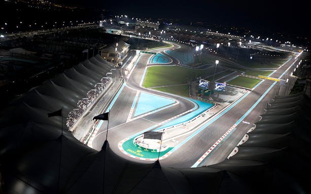 Yas Marina Circuit at night, view of illuminated racetrack for Chevrolet Camaro SS drag driving experience.