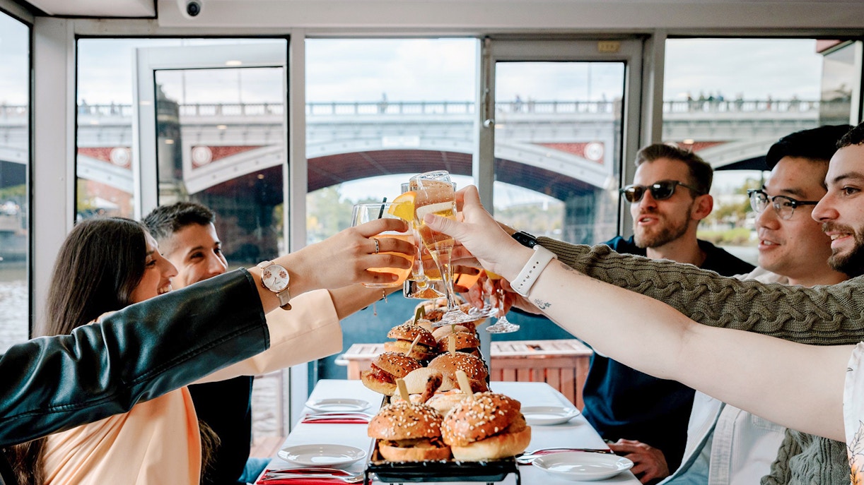 Dining guests toasting with drinks on the Spirit of Melbourne Cruising Restaurant.