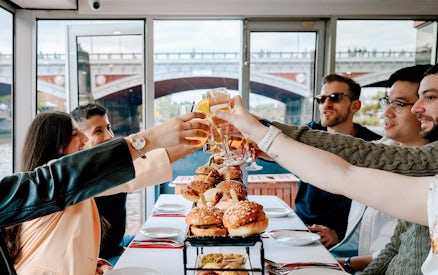 Dining guests toasting with drinks on the Spirit of Melbourne Cruising Restaurant.