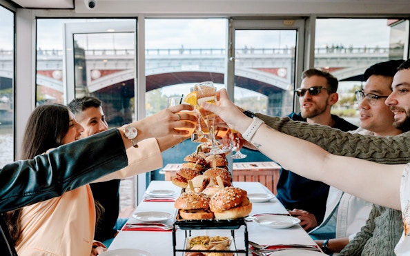 Dining guests toasting with drinks on the Spirit of Melbourne Cruising Restaurant.
