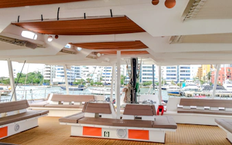 Catamaran deck with seating area docked in Cartagena marina, Colombia.