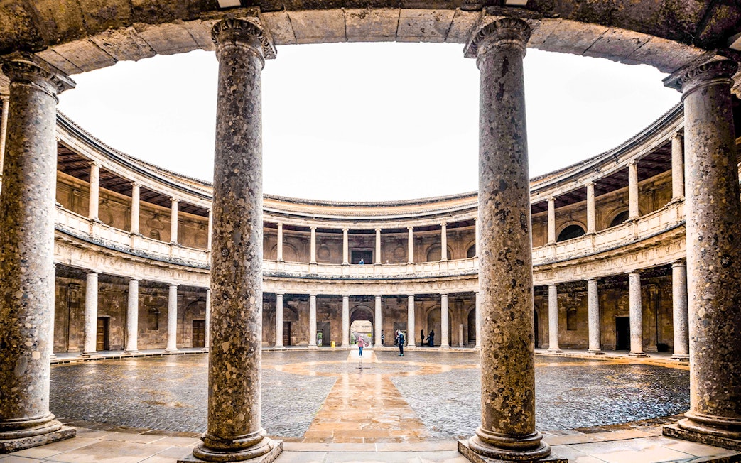 Circular courtyard of the Palace of Charles V at Alhambra, Granada, Spain.