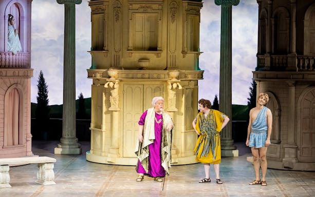 Actors performing "A Funny Thing Happened on the Way to the Forum" on stage in Paris.