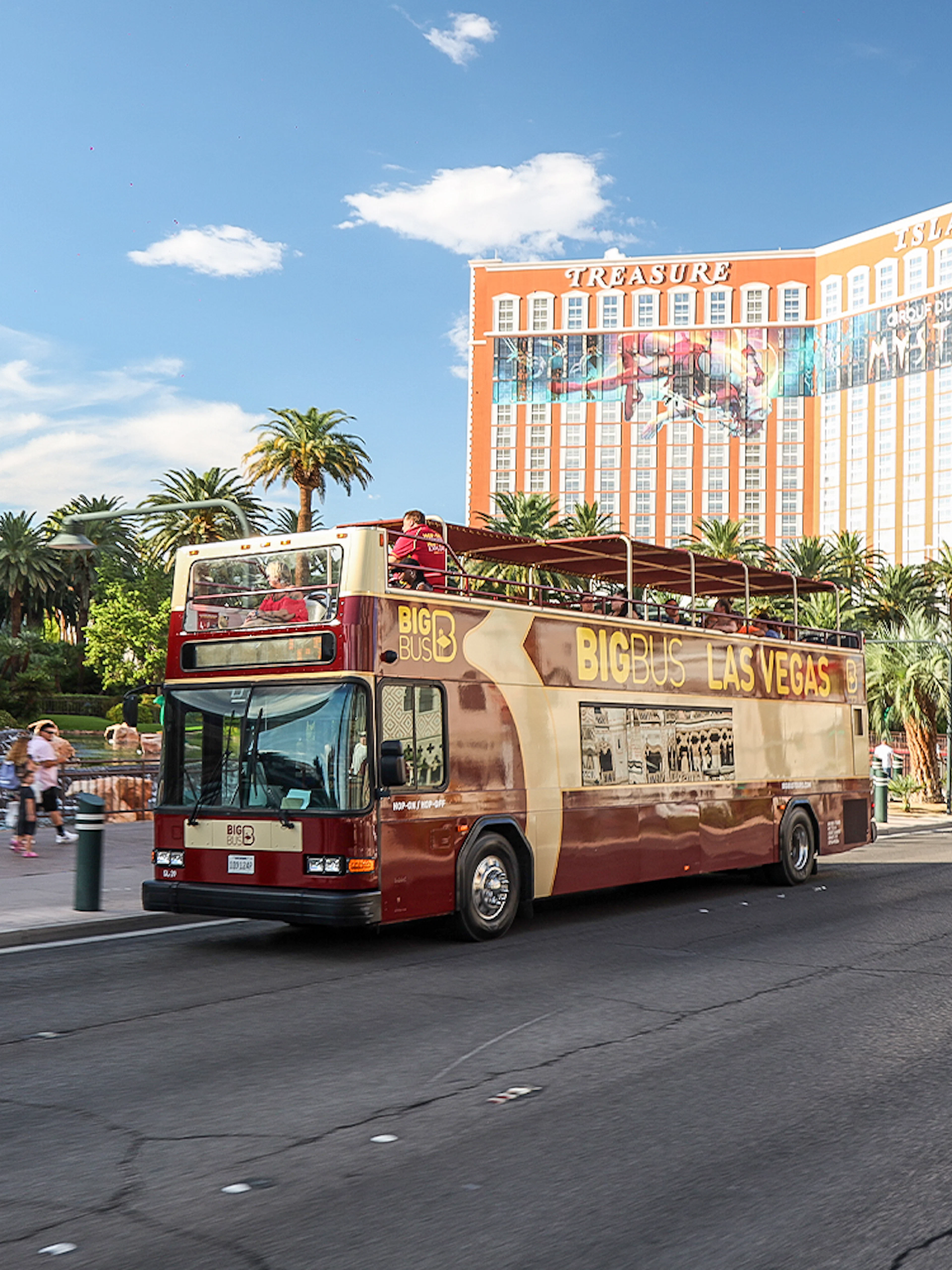Open-top tour bus in front of Treasure Island Hotel, Las Vegas.