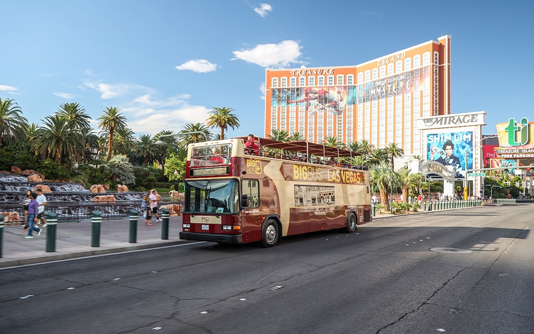 Open-top tour bus in front of Treasure Island Hotel, Las Vegas.