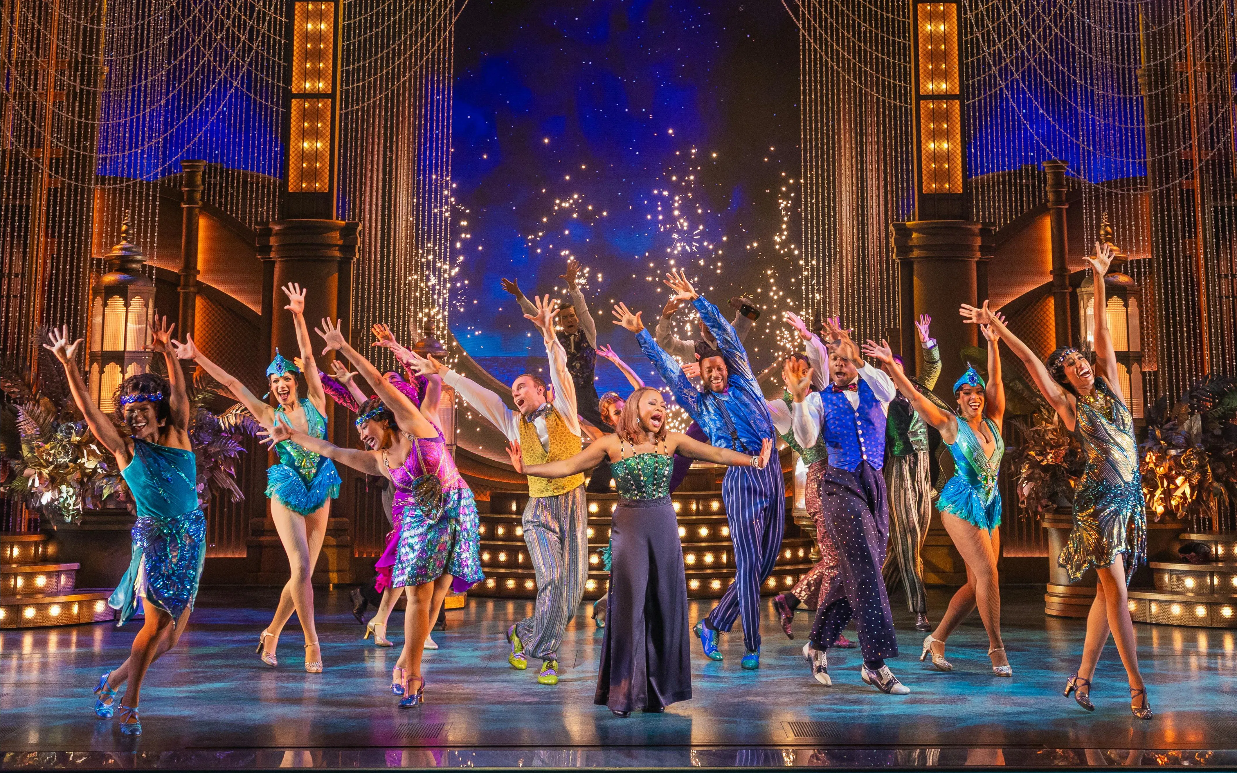 Performers dancing on stage in The Great Gatsby musical on Broadway.