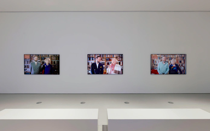 Three video screens displaying portraits at Ragnar Kjartansson: Mercy Exhibition, National Gallery of Victoria.