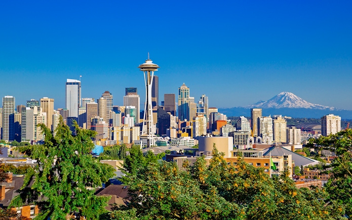 Seattle skyline with Space Needle and Mt Rainier in the background.