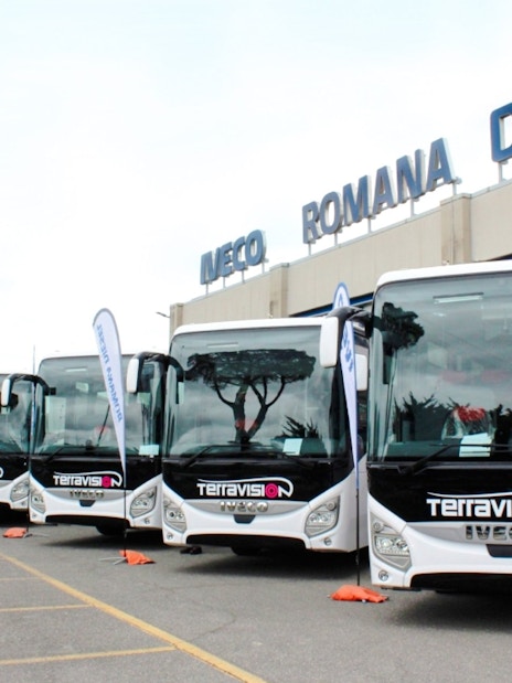 Terravision buses parked outside Iveco Romana Diesel building.