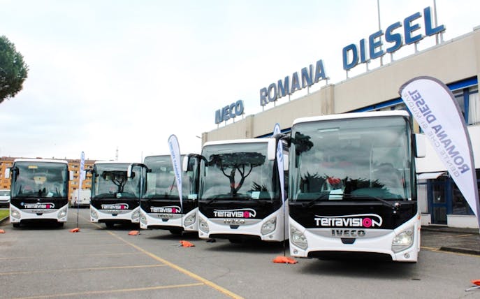 Terravision buses parked outside Iveco Romana Diesel building.