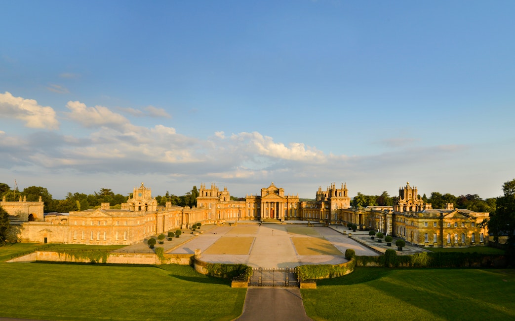 Aerial view of Blenheim Palace in Oxfordshire, England, showcasing its grand architecture and gardens.