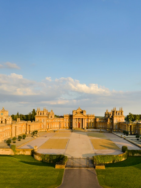 Aerial view of Blenheim Palace in Oxfordshire, England, showcasing its grand architecture and gardens.