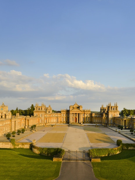 Aerial view of Blenheim Palace in Oxfordshire, England, showcasing its grand architecture and gardens.
