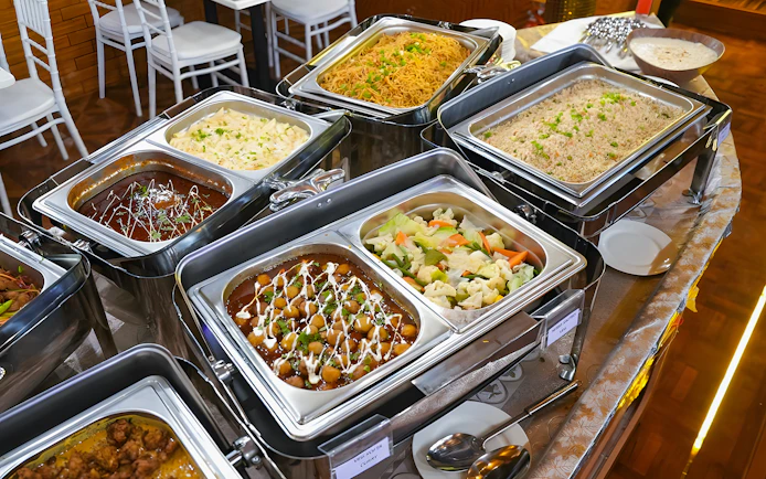 Buffet dinner spread on a Dubai Marina dhow cruise with various dishes.