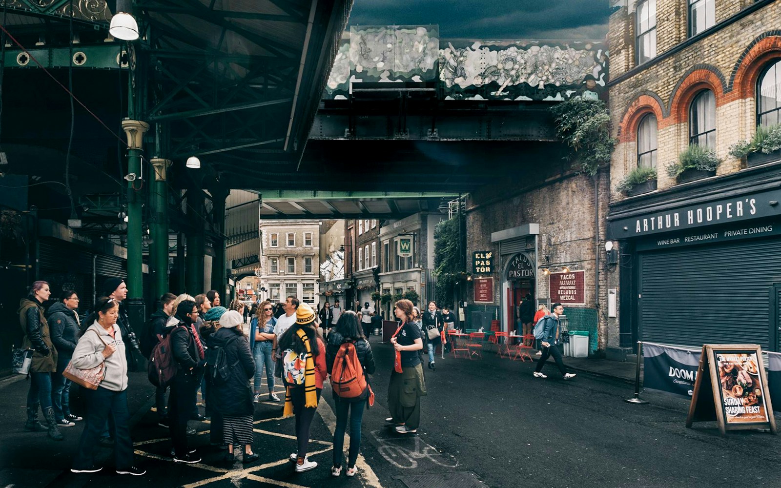 Group of tourists at Borough Market, a Harry Potter film location in London.